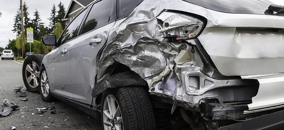 A car is hit from behind in an accident showing severe damage