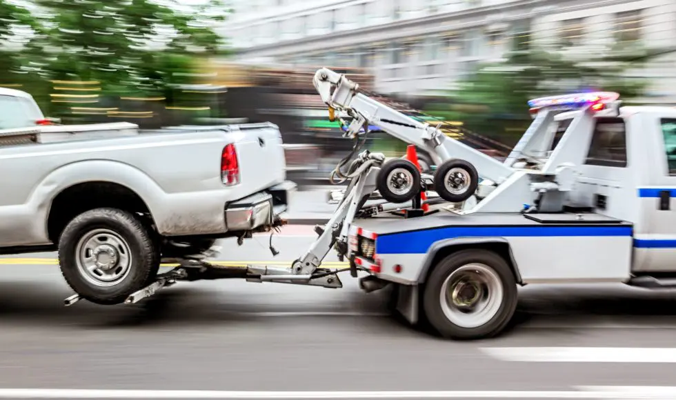 police department tow truck delivers the damaged vehicle
