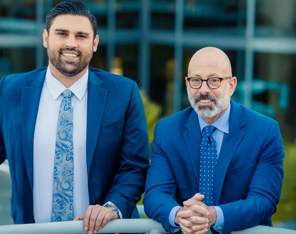 Two men in blue business suits